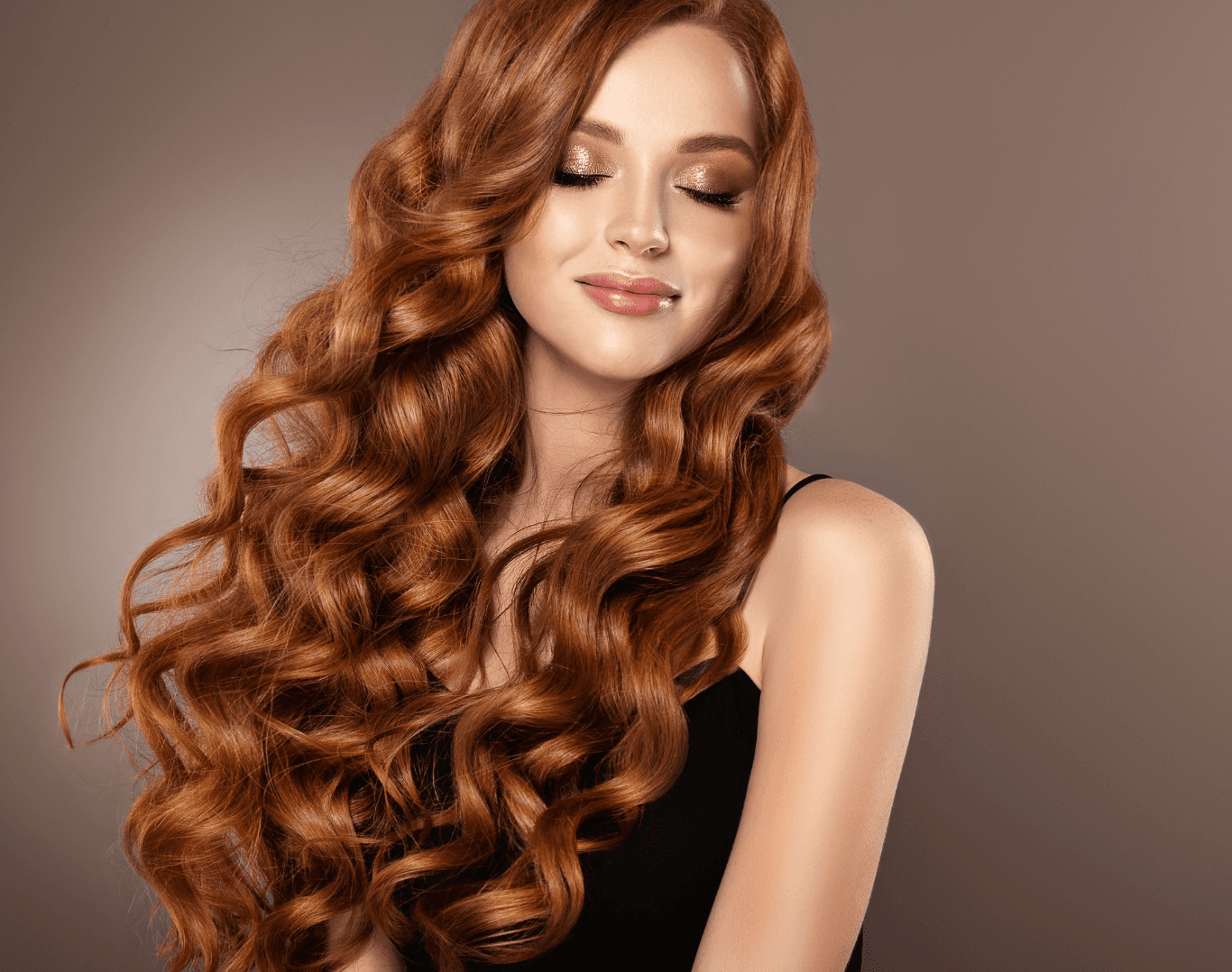 Woman with long, voluminous curls created using GHD styling at Directors Cut Hair, Nails and Beauty, Crystal Peaks, Sheffield