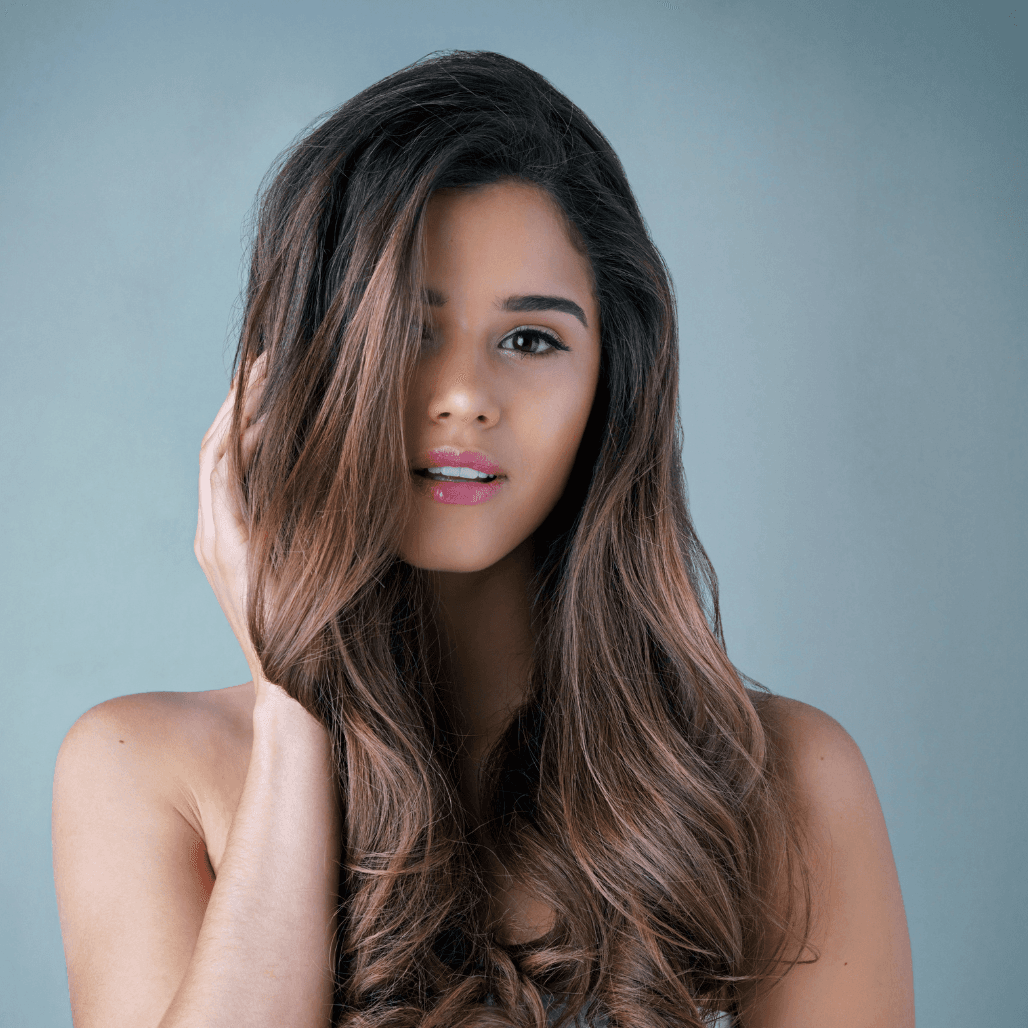 Woman with rich brunette hair colour, professionally coloured at Director’s Cut Hair Salon in Crystal Peaks, Sheffield.