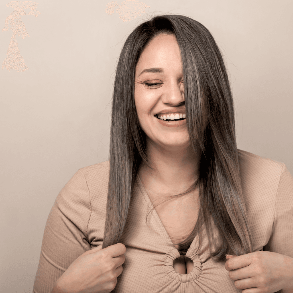 Smiling woman with smooth, healthy hair after a deep conditioning treatment at Director’s Cut salon in Crystal Peaks, Sheffield.