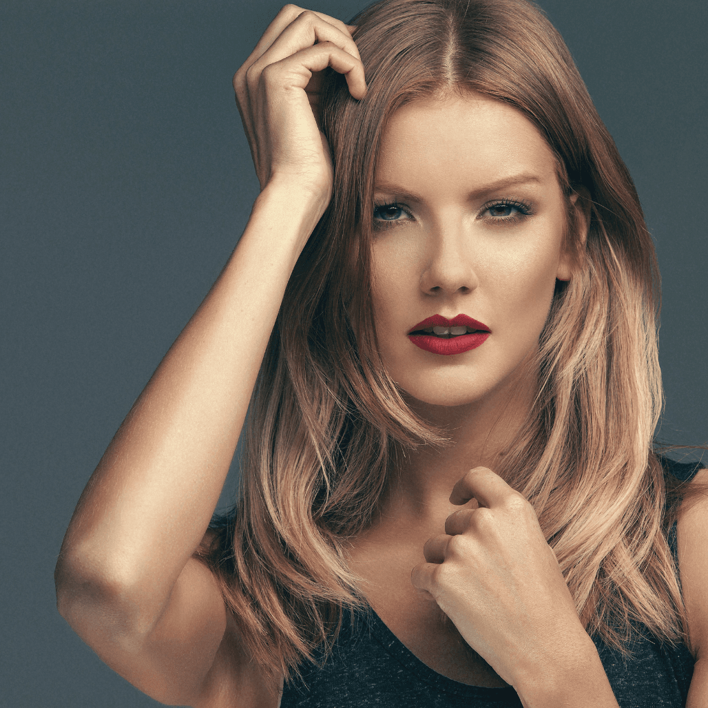 Woman with freshly cut and styled blonde hair, showcasing professional hairdressing results at Director’s Cut in Crystal Peaks, Sheffield.
