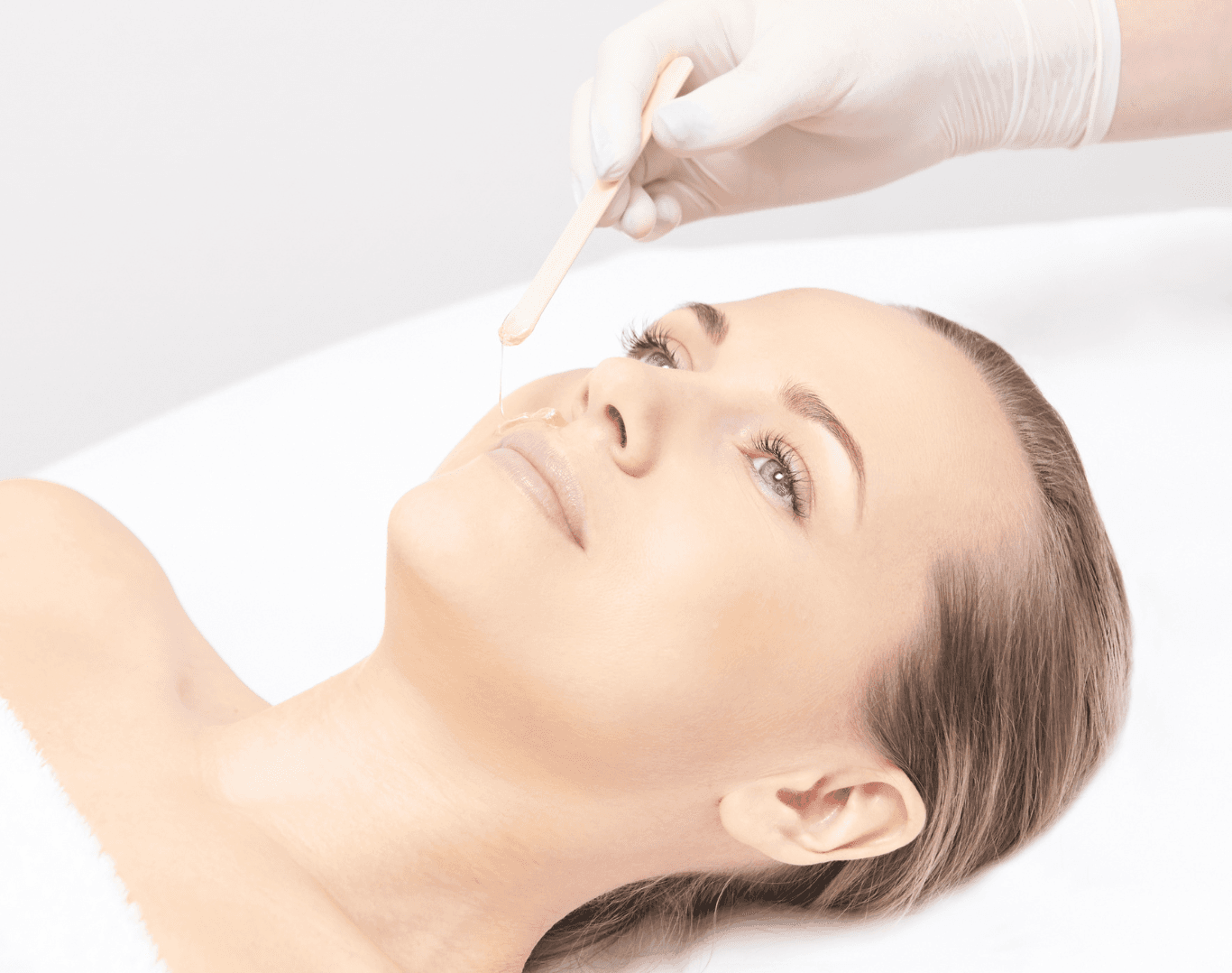 Woman receiving a professional lip and chin waxing treatment at Directors Cut Hair, Nails and Beauty, Crystal Peaks, Sheffield