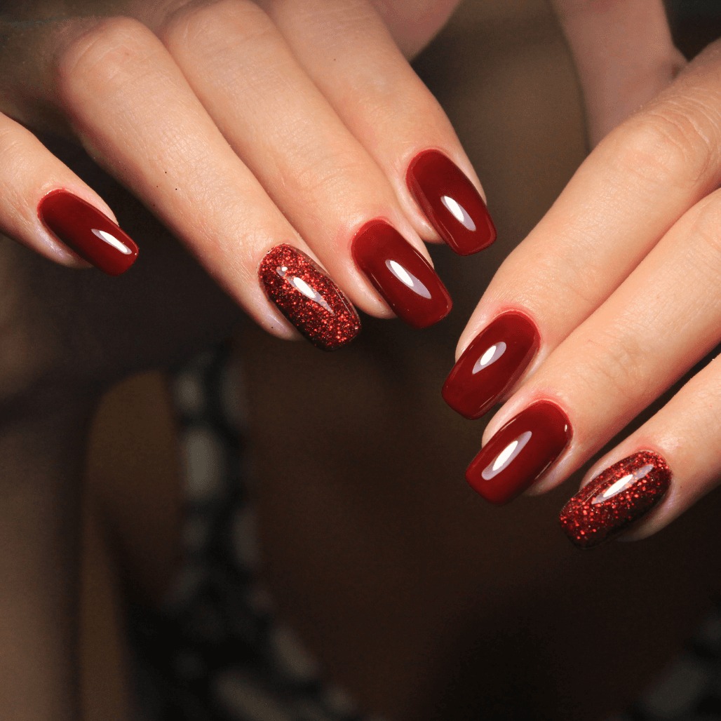 Glossy red gel manicure with glitter accent nail, expertly done at Director’s Cut salon in Crystal Peaks, Sheffield.