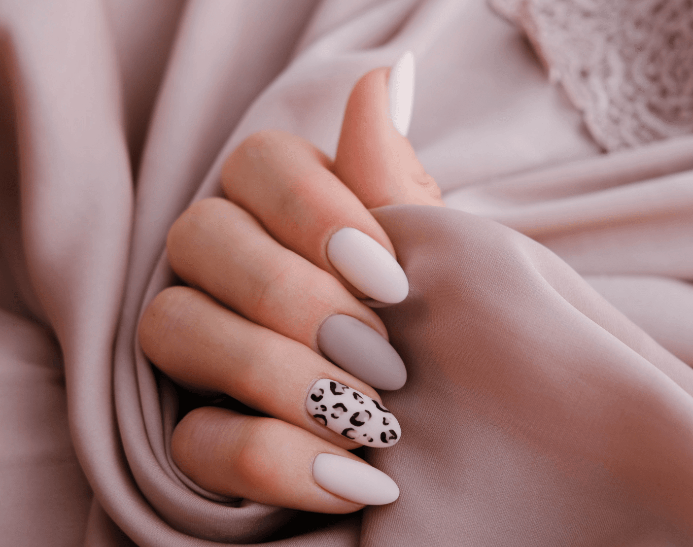 Close-up of elegant nude nails with leopard print nail art at Directors Cut Hair, Nails and Beauty, Crystal Peaks, Sheffield