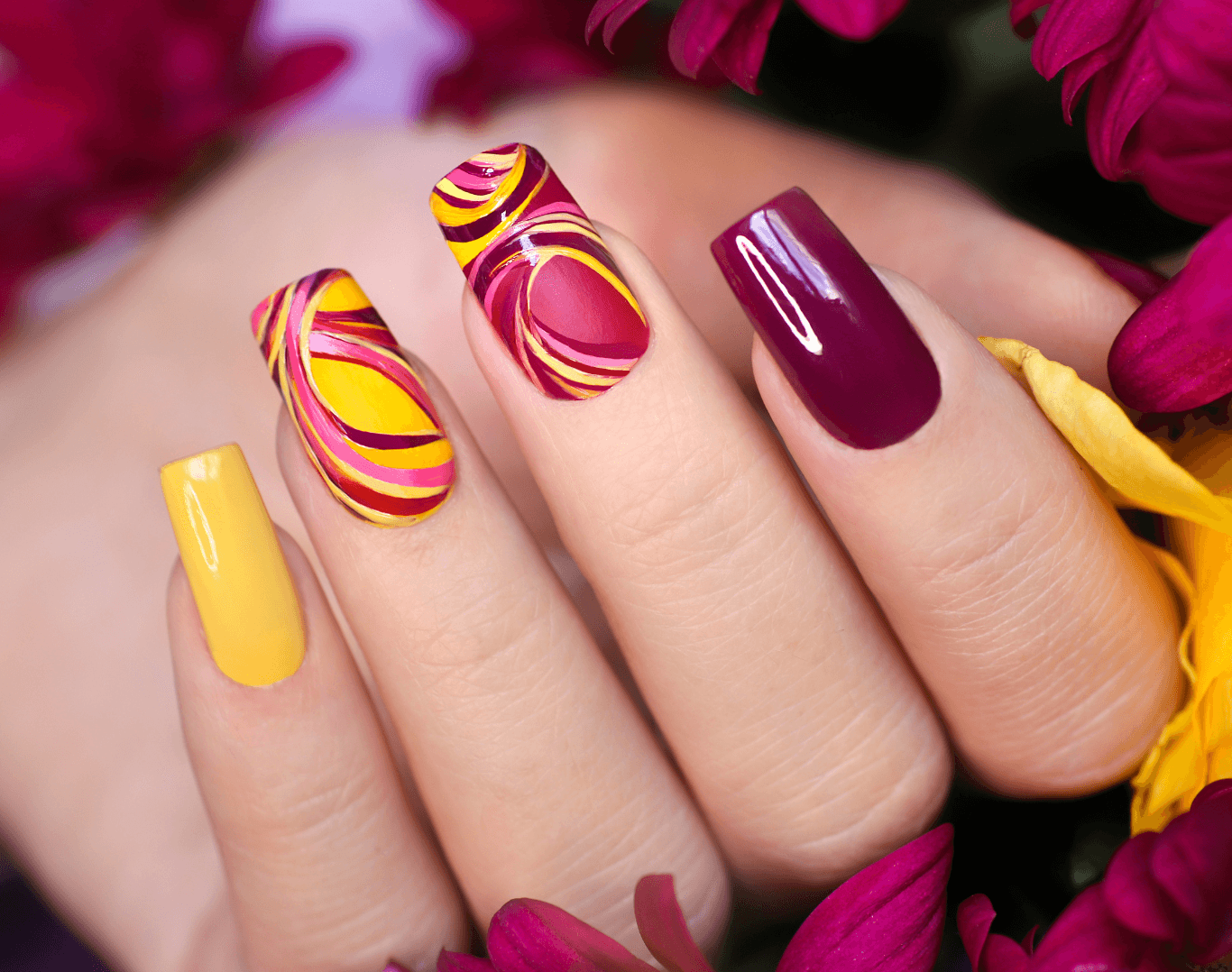 Close-up of colourful full set of nail extensions with intricate design at Directors Cut Hair, Nails and Beauty, Crystal Peaks, Sheffield