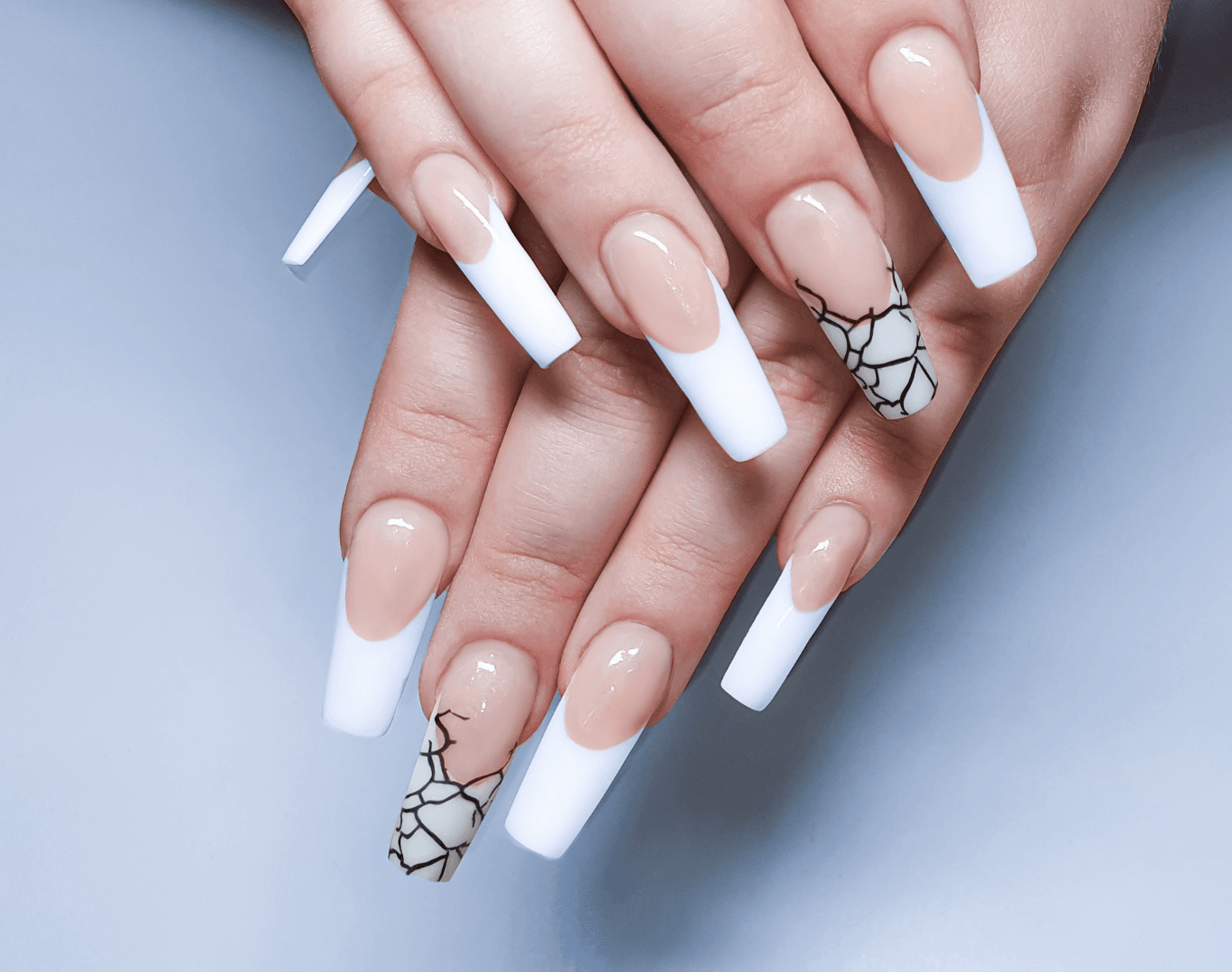Hands with long, sculpted nail overlays using builder gel and custom nail art at Directors Cut Hair, Nails and Beauty, Crystal Peaks, Sheffield