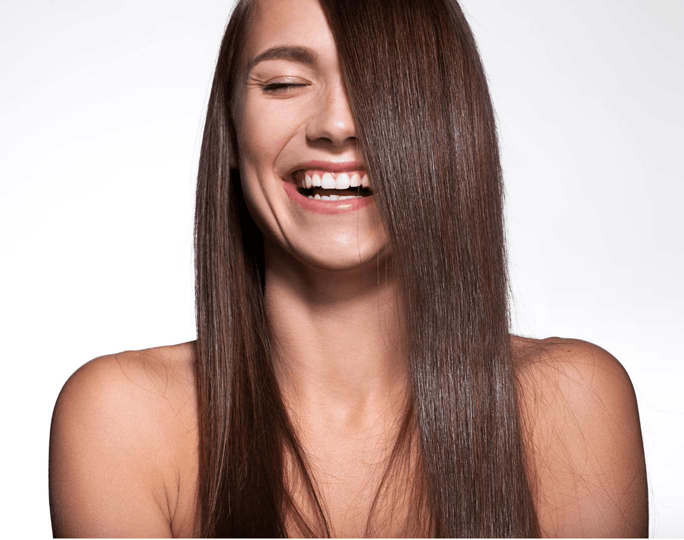 Laughing woman with sleek, freshly coloured hair after a semi-permanent colour treatment at Directors Cut Hair, Nails and Beauty, Crystal Peaks, Sheffield