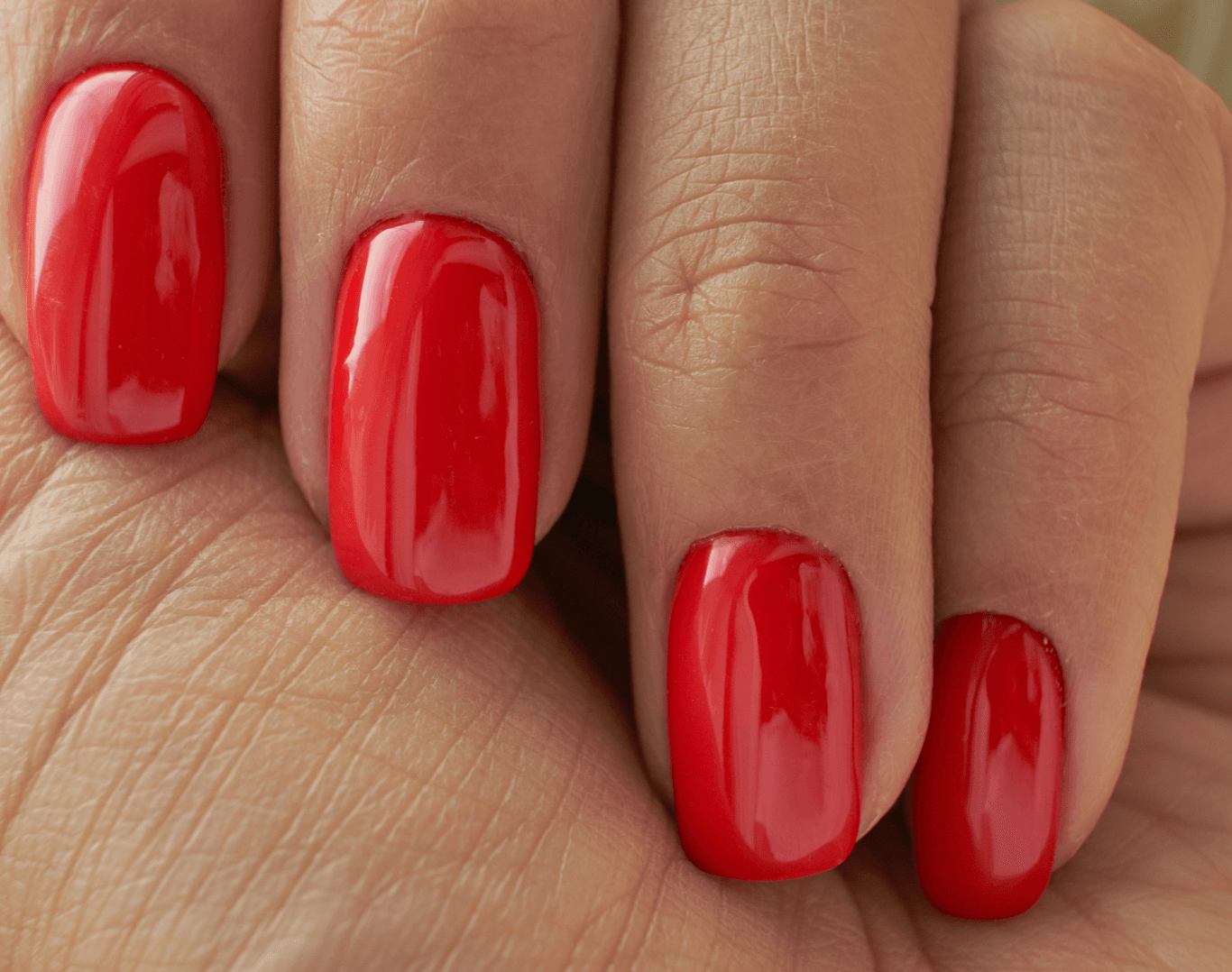 Close-up of glossy red Shellac nails after soak-off and colour reapplication at Directors Cut Hair, Nails and Beauty, Crystal Peaks, Sheffield