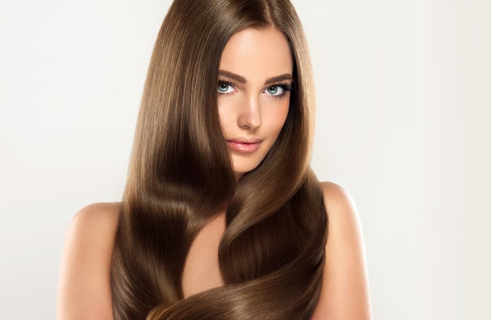 Model with silky, smooth, voluminous hair after Wella SmoothFiller™ treatment at Directors Cut salon in Crystal Peaks, Sheffield.